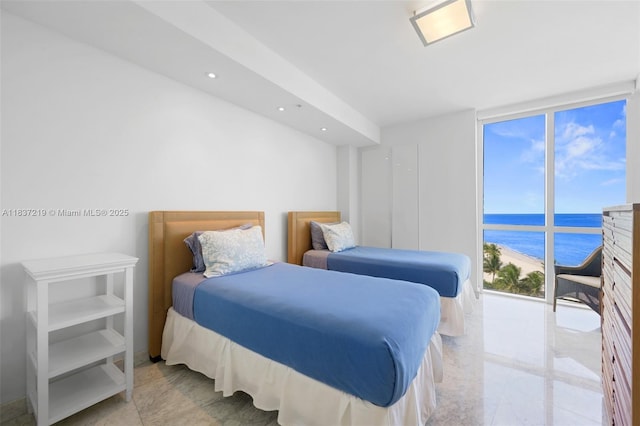 18201 Collins Ave Unit 1006, Sunny Isles Beach, FL 33160 - bedroom featuring a water view, recessed lighting, and floor to ceiling windows