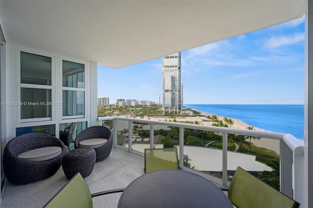18201 Collins Ave Unit 1006, Sunny Isles Beach, FL 33160 - balcony with outdoor dining area, a city view, and a water view