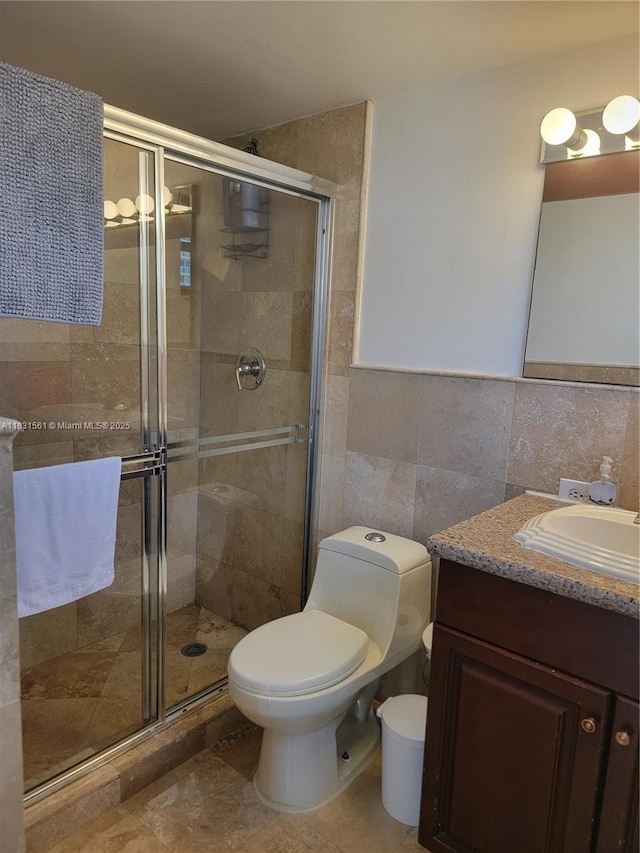 17021 N Bay Rd Unit 1015, Sunny Isles Beach, FL 33160 - full bathroom with tile walls, vanity, and a stall shower
