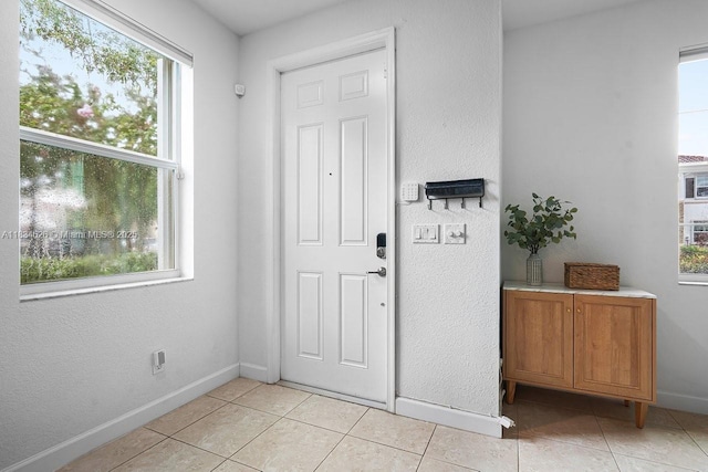 4326 Braxton Ave, West Palm Beach, FL 33417 - entrance foyer with light tile patterned flooring and baseboards