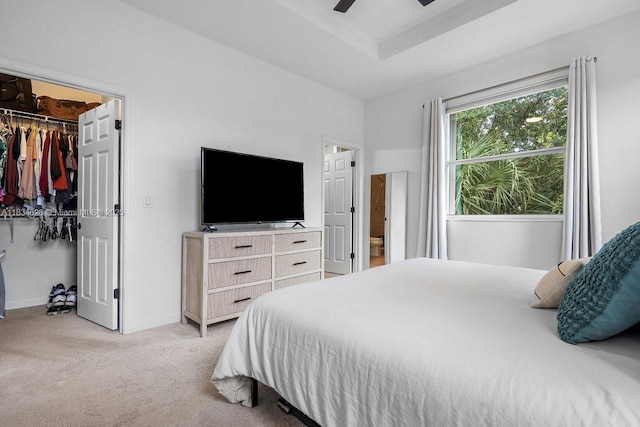 4326 Braxton Ave, West Palm Beach, FL 33417 - bedroom featuring light carpet, a spacious closet, and a ceiling fan