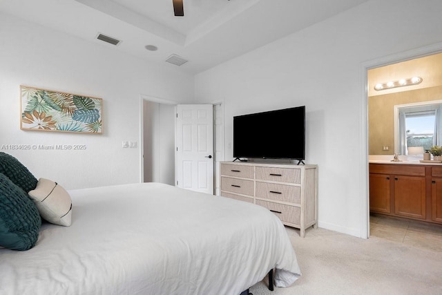 4326 Braxton Ave, West Palm Beach, FL 33417 - bedroom with light colored carpet, connected bathroom, and ceiling fan