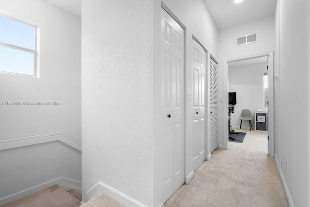 4326 Braxton Ave, West Palm Beach, FL 33417 - hall with healthy amount of natural light and light carpet