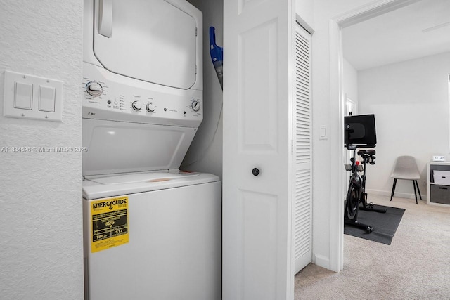 4326 Braxton Ave, West Palm Beach, FL 33417 - washroom featuring stacked washing machine and dryer and carpet