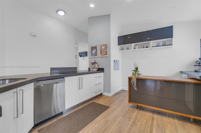 16410 Sapphire Bnd, Weston, FL 33331 - kitchen with stainless steel dishwasher, light wood-style flooring, white cabinets, dark countertops, and recessed lighting
