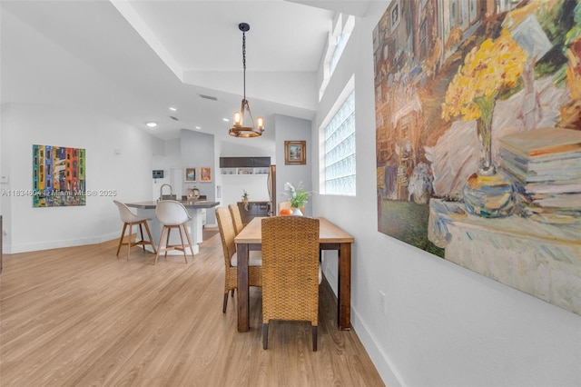 16410 Sapphire Bnd, Weston, FL 33331 - dining area with a chandelier, light wood-type flooring, recessed lighting, and lofted ceiling