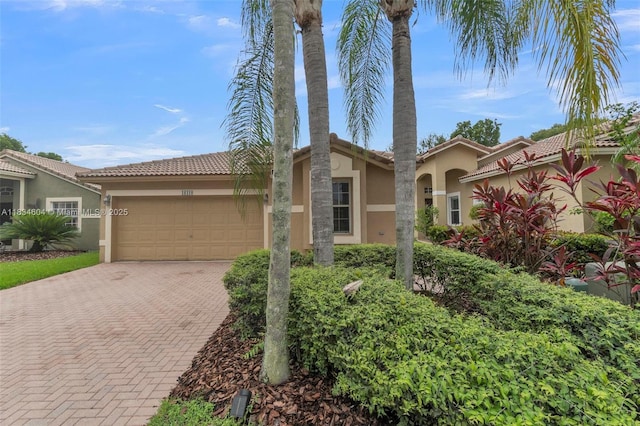 16410 Sapphire Bnd, Weston, FL 33331 - view of front of property with stucco siding, decorative driveway, a garage, and a tiled roof