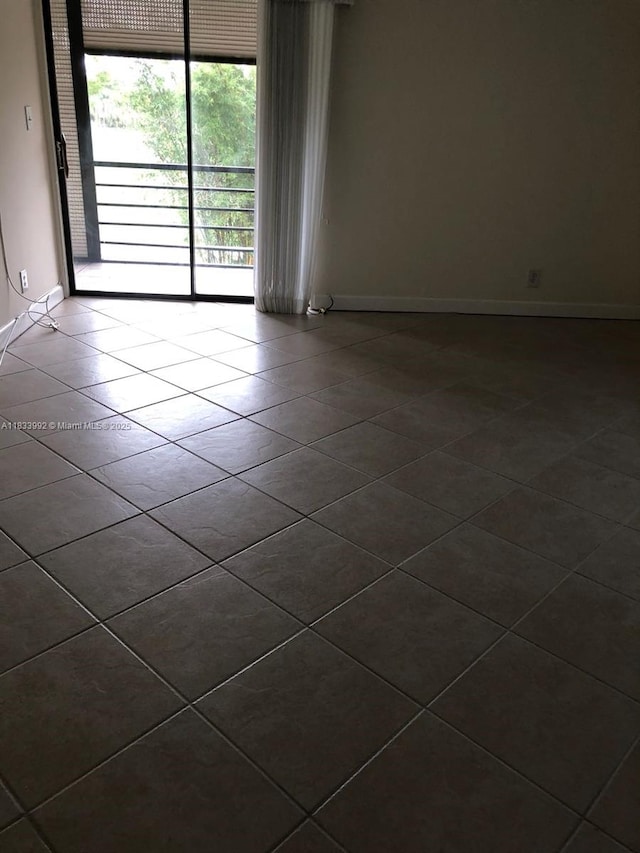 4000 N Hills Dr Unit 32, Hollywood, FL 33021 - empty room featuring dark tile patterned flooring