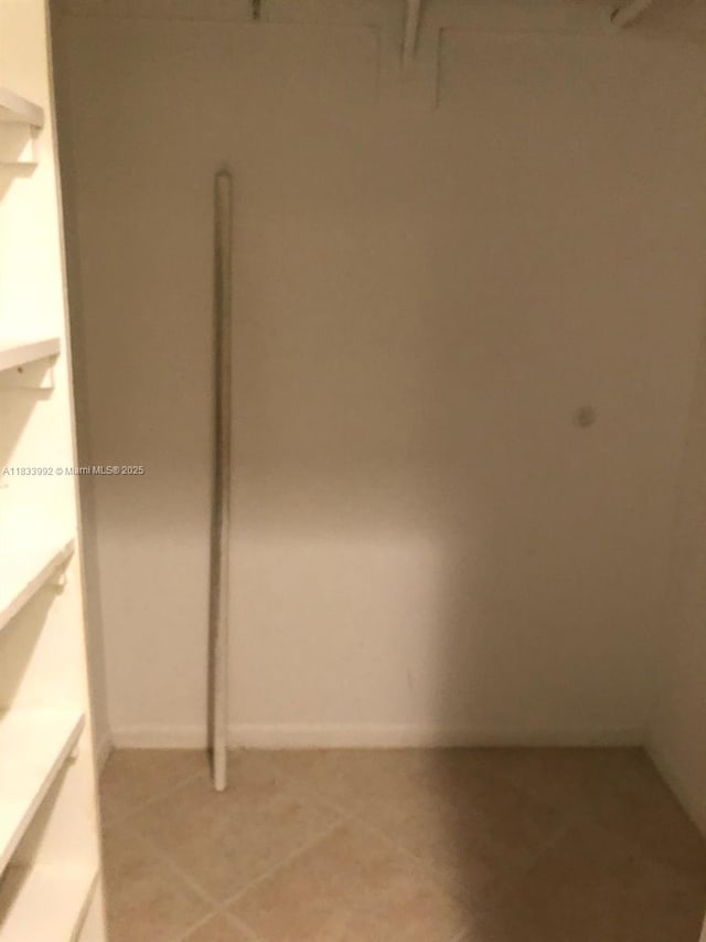 4000 N Hills Dr Unit 32, Hollywood, FL 33021 - walk in closet featuring light tile patterned floors