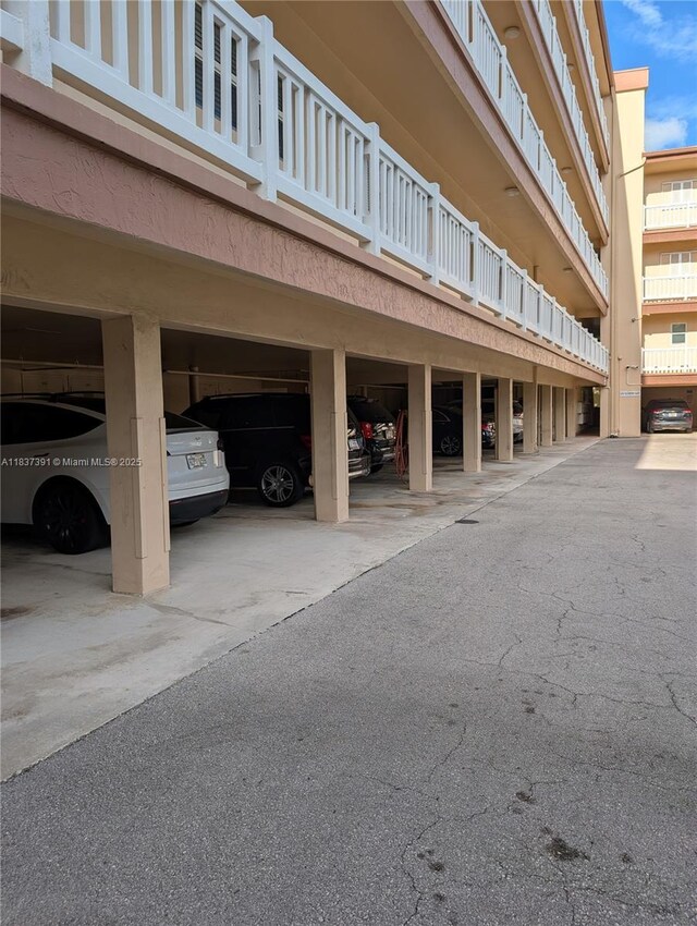 6751 Cypress Rd Unit 405, Plantation, FL 33317 - view of property featuring covered parking