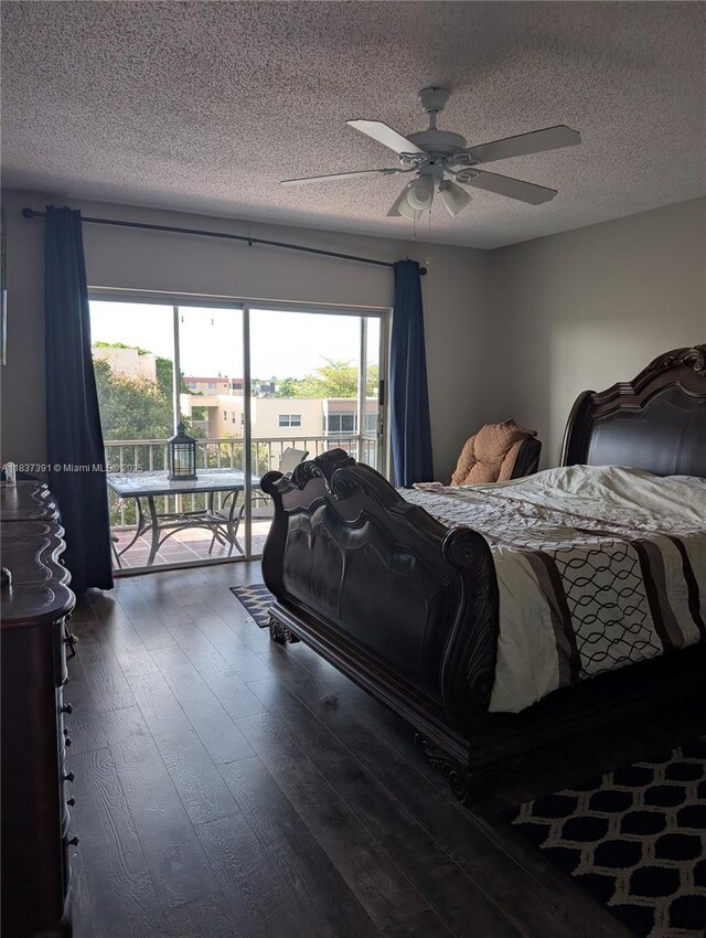 6751 Cypress Rd Unit 405, Plantation, FL 33317 - bedroom featuring access to exterior, a textured ceiling, dark wood-style flooring, and a ceiling fan