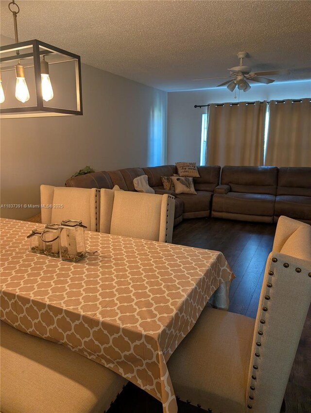 6751 Cypress Rd Unit 405, Plantation, FL 33317 - dining area featuring a ceiling fan, dark wood-type flooring, and a textured ceiling