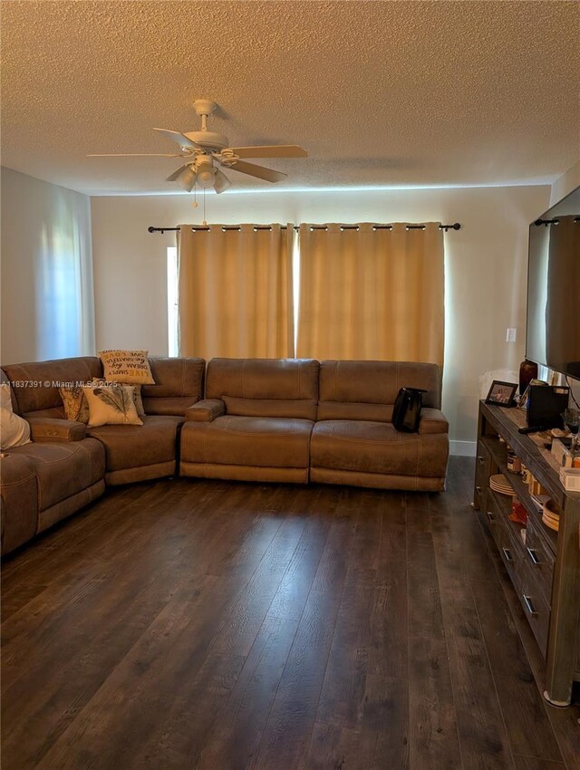 6751 Cypress Rd Unit 405, Plantation, FL 33317 - living area with dark wood-type flooring, a ceiling fan, and a textured ceiling