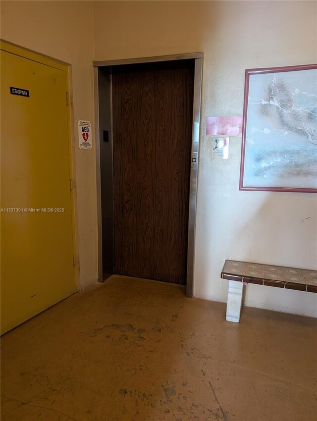 6751 Cypress Rd Unit 405, Plantation, FL 33317 - hallway featuring elevator