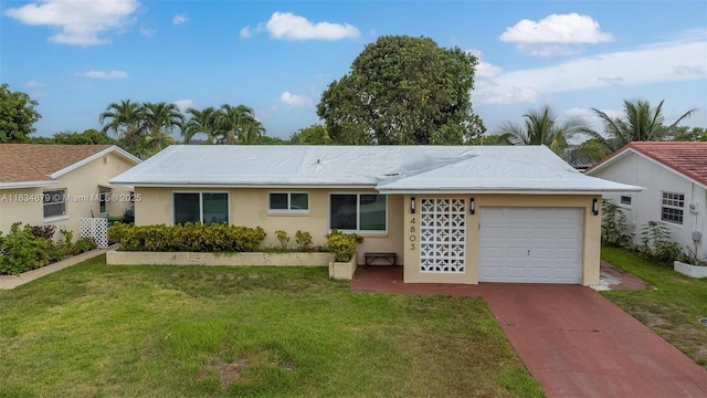4803 NW 47th Ter, Tamarac, FL 33319 - single story home with a garage, a front yard, driveway, and stucco siding