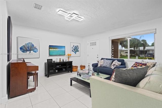 4803 NW 47th Ter, Tamarac, FL 33319 - living area featuring a textured ceiling and light tile patterned flooring