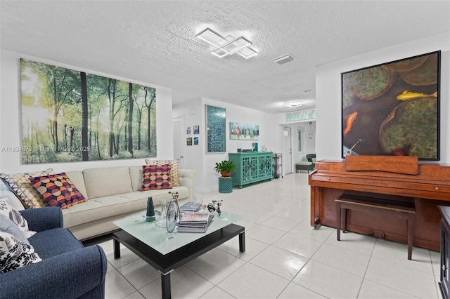 4803 NW 47th Ter, Tamarac, FL 33319 - living area with light tile patterned floors and a textured ceiling