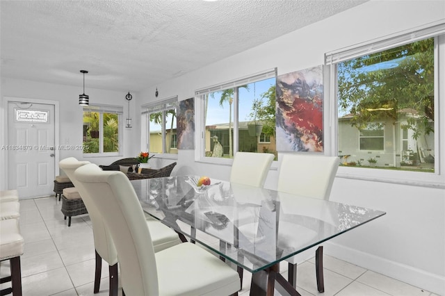 4803 NW 47th Ter, Tamarac, FL 33319 - dining area with light tile patterned floors and a textured ceiling