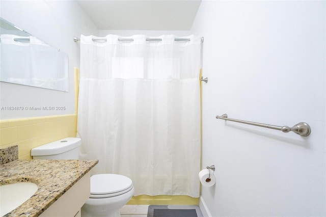 4803 NW 47th Ter, Tamarac, FL 33319 - bathroom featuring vanity, tile walls, a shower with curtain, and tile patterned floors