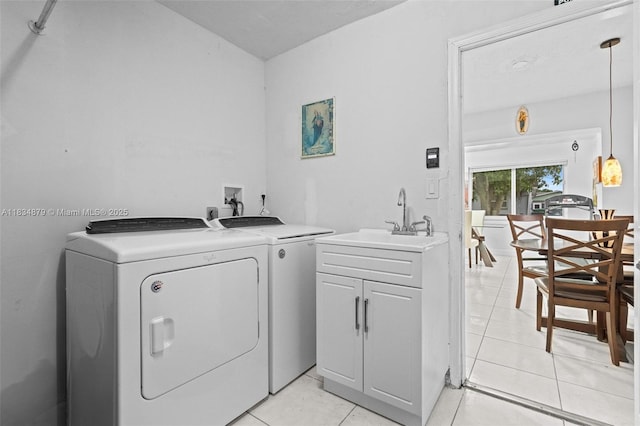 4803 NW 47th Ter, Tamarac, FL 33319 - washroom with washer and clothes dryer and light tile patterned flooring
