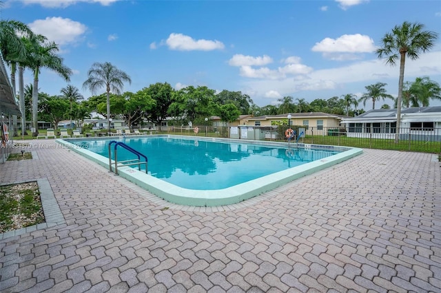 4803 NW 47th Ter, Tamarac, FL 33319 - community pool featuring a patio
