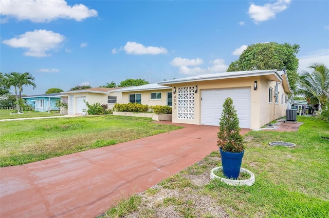 4803 NW 47th Ter, Tamarac, FL 33319 - ranch-style home featuring a garage, a front yard, concrete driveway, and stucco siding