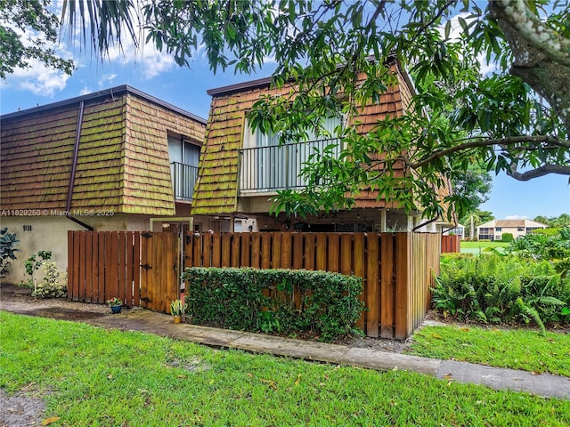 9111 SW 22nd Ct Unit B-3, Davie, FL 33324 - view of front of property featuring a gate and mansard roof