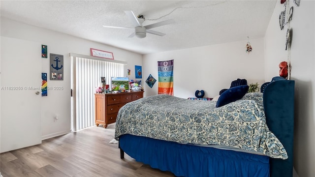 9111 SW 22nd Ct Unit B-3, Davie, FL 33324 - bedroom with wood finished floors, a textured ceiling, and ceiling fan
