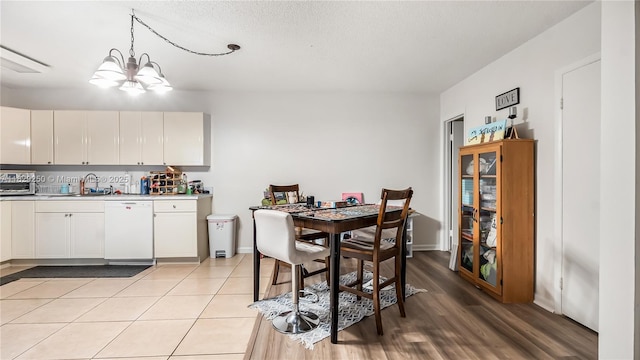 9111 SW 22nd Ct Unit B-3, Davie, FL 33324 - dining area with a chandelier and light wood-style floors