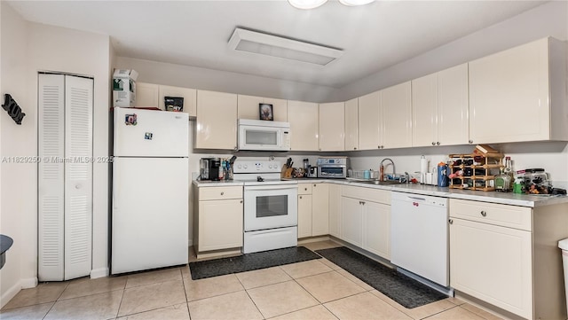 9111 SW 22nd Ct Unit B-3, Davie, FL 33324 - kitchen featuring white appliances, light countertops, light tile patterned floors, and white cabinets