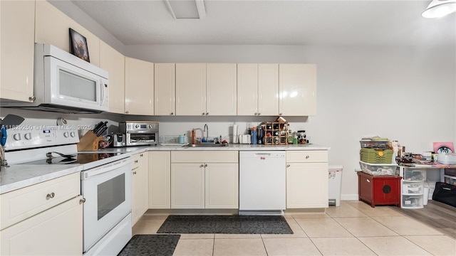 9111 SW 22nd Ct Unit B-3, Davie, FL 33324 - kitchen featuring white appliances, light countertops, and light tile patterned flooring
