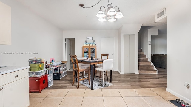 9111 SW 22nd Ct Unit B-3, Davie, FL 33324 - dining room featuring a chandelier, light tile patterned floors, and stairs