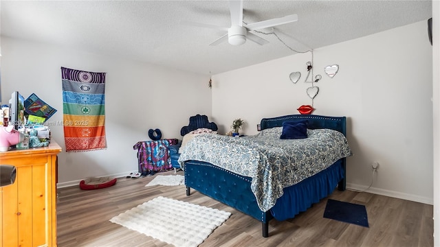 9111 SW 22nd Ct Unit B-3, Davie, FL 33324 - bedroom featuring wood finished floors, a textured ceiling, and a ceiling fan