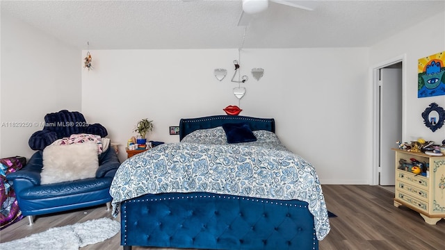 9111 SW 22nd Ct Unit B-3, Davie, FL 33324 - bedroom with wood finished floors, a ceiling fan, and a textured ceiling