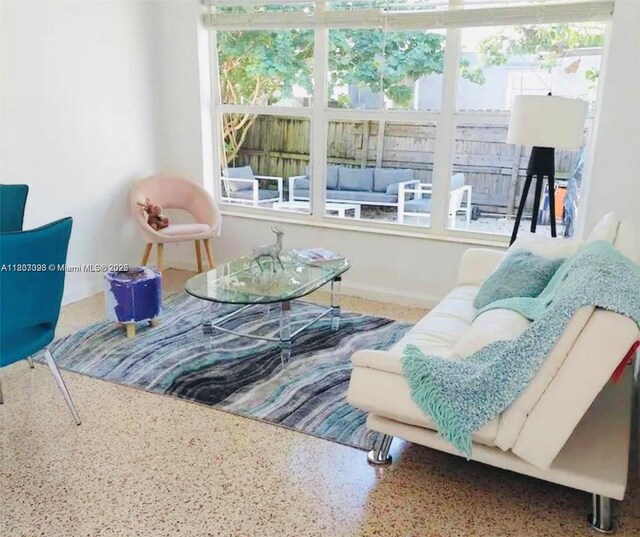1236 NE 109th St, Miami, FL 33161 - sitting room featuring speckled floor and plenty of natural light