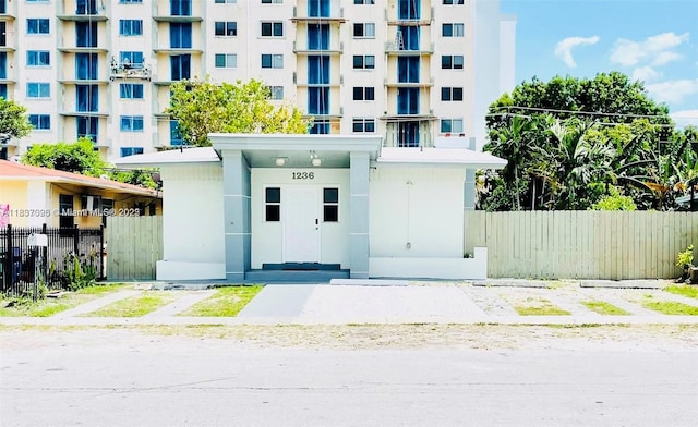 1236 NE 109th St, Miami, FL 33161 - view of apartment building / complex featuring uncovered parking