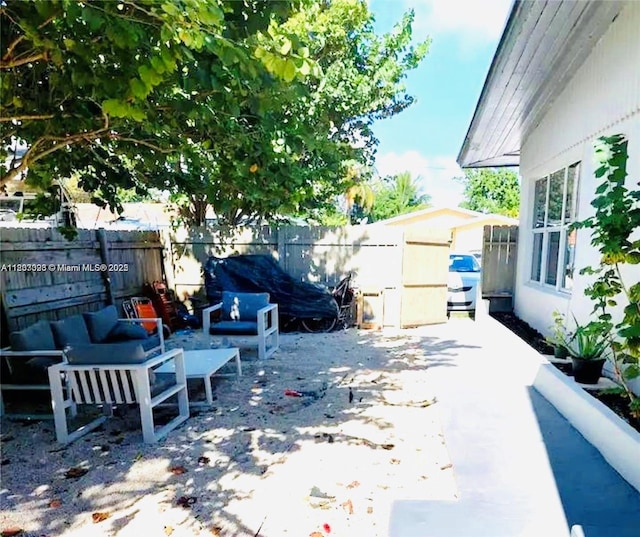 1236 NE 109th St, Miami, FL 33161 - fenced backyard with an outdoor hangout area and a patio