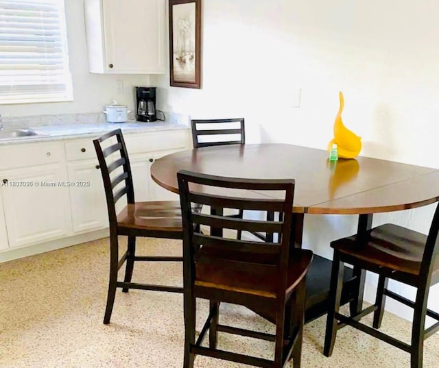 1236 NE 109th St, Miami, FL 33161 - dining room with dark speckled floor