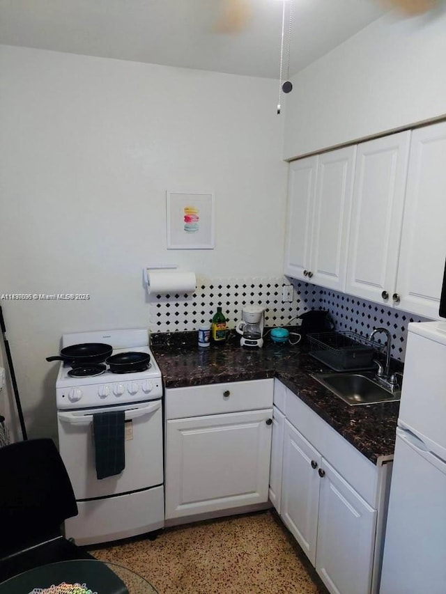 1236 NE 109th St, Miami, FL 33161 - kitchen featuring electric stove, white cabinets, dark aggregate flooring, and fridge