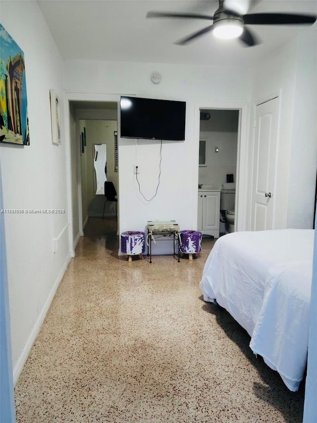 1236 NE 109th St, Miami, FL 33161 - bedroom featuring speckled floor, ensuite bath, and a ceiling fan