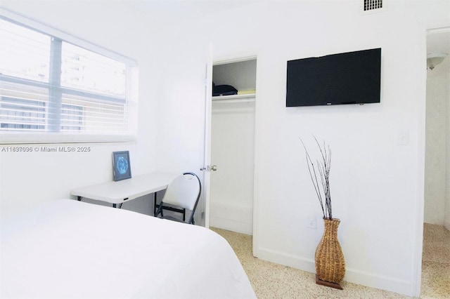 1236 NE 109th St, Miami, FL 33161 - bedroom featuring speckle patterned floor and a closet