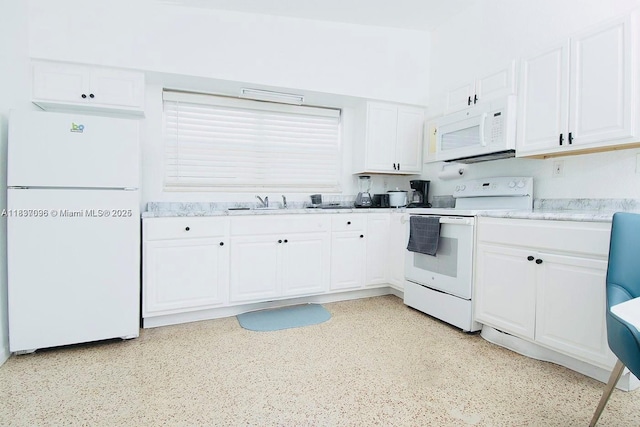 1236 NE 109th St, Miami, FL 33161 - kitchen featuring white appliances, white cabinets, and light countertops