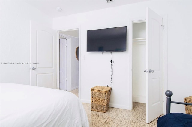 1236 NE 109th St, Miami, FL 33161 - bedroom with dark aggregate flooring and baseboards