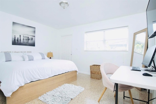 1236 NE 109th St, Miami, FL 33161 - bedroom featuring speckle patterned floor and an office area