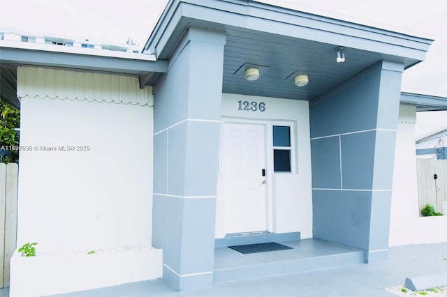1236 NE 109th St, Miami, FL 33161 - doorway to property featuring stucco siding