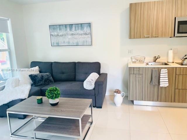 1419 W Ave Unit 106, Miami Beach, FL 33139 - living area with light tile patterned floors