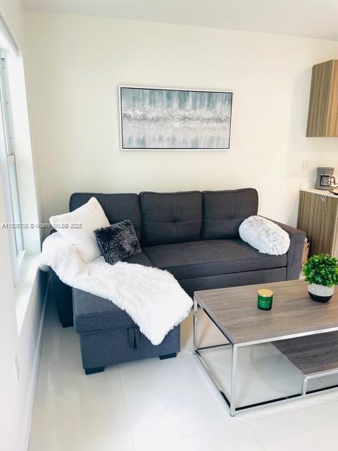 1419 W Ave Unit 106, Miami Beach, FL 33139 - living room featuring tile patterned floors