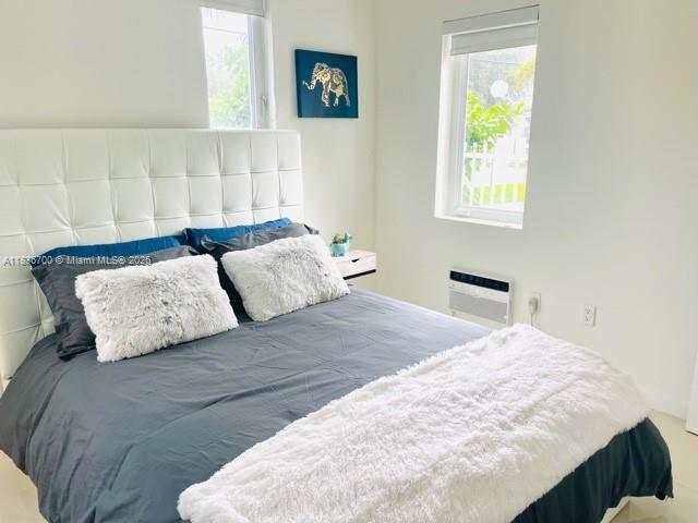 1419 W Ave Unit 106, Miami Beach, FL 33139 - bedroom with a wall mounted AC