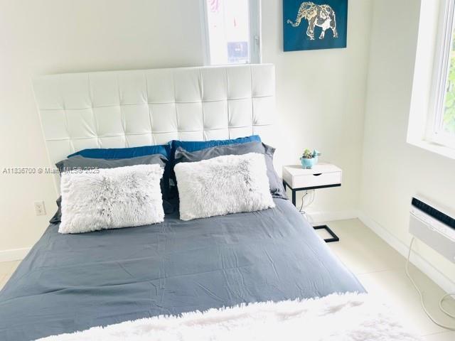 1419 W Ave Unit 106, Miami Beach, FL 33139 - bedroom featuring baseboards