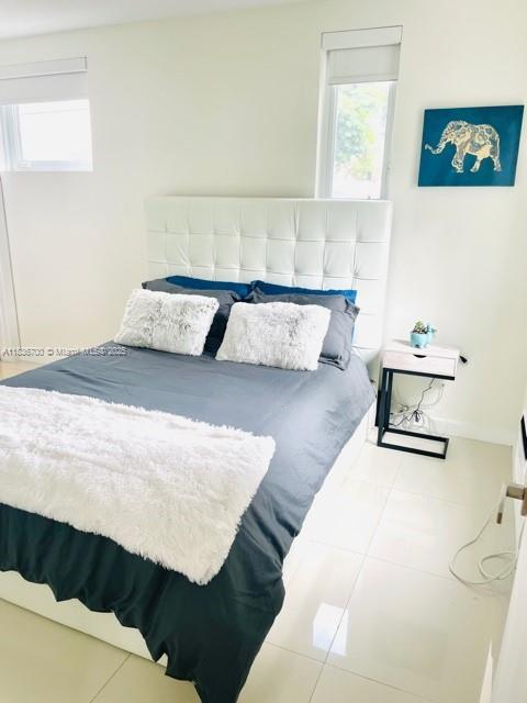 1419 W Ave Unit 106, Miami Beach, FL 33139 - bedroom featuring tile patterned floors